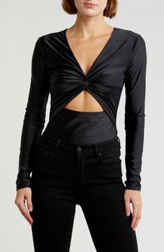 Designed to be layered under any outfit, this sulty bodysuit features a deep V-neckline and midsection cutout. Snap closure Deep V-neck Long sleeves 82% nylon, 18% elastane Hand wash, line dry Imported Black Owned/Founded Fitted Twist Front Top For Night Out, Fitted Twist Front Top For Evening, Long Sleeve Cutout Bodysuit For Night Out, Fitted V-neck Bodysuit For Night Out, Fitted V-neck Cutout Bodysuit, Sleek V-neck Bodysuit For Night Out, Sleek Fitted V-neck Bodysuit, Fitted Low-cut Bodysuit For Night Out, Fitted V-neck Bodysuit For Club