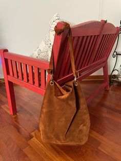 The hobo style of this Hobo Bag Leather offers a relaxed, soft look, while its shape ensures it's roomy enough to fit all your essentials.  The Suede Hobo Bag is equipped with a long shoulder strap. You can tie a knot at the shoulder strap, this allows you to wear it over the shoulder or crossbody, providing a comfortable, hands-free option. This Brown Hobo Bag is crafted with the finest quality Italian suede known for its softness, durability and unique texture. Suede is made from the underside Hobo Bucket Bag With Adjustable Strap For Errands, Brown Hobo Shoulder Bag For On-the-go, Hobo Bag With Adjustable Strap For Errands, On-the-go Hobo Bag With Adjustable Strap, Everyday Pouch Baguette Bag With Handles, Modern Hobo Shoulder Bag, Hobo Bag With Removable Pouch, Hobo Bucket Bag With Adjustable Strap For Shopping, Adjustable Strap Hobo Bucket Bag For Shopping