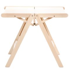 a small wooden table with two legs and a white surface on the top, in front of a white background