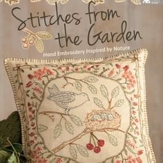 the cover of stitches from the garden by kathy schnitzt, featuring an embroidered pillow