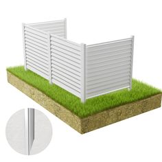 a white fence sitting on top of a green grass covered field next to a metal pole