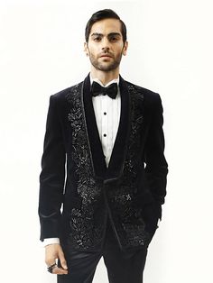 Astrum handcrafted tuxedo is highlighted with metallic threads. Single-buttoned satin detail shawl collar. This creation in velvet can be tempered with flat-front trousers for a reception look. Luxury Festive Tuxedo For Gala, Formal Embroidered Tailored Tuxedo, Formal Tailored Embroidered Tuxedo, Designer Embroidered Tuxedo For Parties, Luxury Embroidered Tuxedo For Party, Luxury Embroidered Party Tuxedo, Luxury Velvet Blazer For Parties, Elegant Embroidered Evening Suits, Luxury Velvet Party Blazer