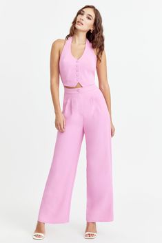 A stunning two-piece set in one! This jumpsuit resembles a chic vest set with a halter neck and comfortable elastic backing. Jumpsuit Halter neck Wide leg pants Lined Bodice Length: 17 1/2" Inseam: 29 7/8" Chest: 16 1/4" Waist: 14" Self: 100% Polyester Lining: 97% Polyester, 3% Spandex Hand wash cold with similar colors. Do not tumble dry, iron, or dry clean. Model is wearing a size S Style #: F242P6409 Fondant Pink, Pants Jumpsuit, Jumpsuits And Rompers, 21 Birthday, Vest Set, Halter Jumpsuit, Pink Pants, Pink Outfits, New Arrival Dress