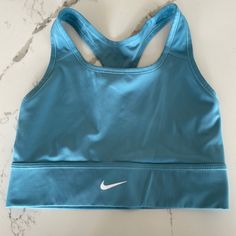 Teal Nike Sports Bra! Size Medium! No Pads Never Worn! Perfect Condition!! Blue Crop Top With Built-in Bra For Gym, Blue Sports Bra With Built-in Bra For Light Exercise, Blue Sports Bra With Built-in Bra For Workout, Blue Moisture-wicking Crop Top For Gym, Blue Gym Crop Top With Built-in Bra, Blue Sports Crop Top Bra Friendly, Blue Racerback Sports Bra With Medium Bust Support, Blue Top For Training With Light Support, Blue Tops With Light Support For Gym