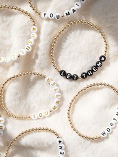 The simple words "You Matter" are a powerful reminder that you are seen, heard, and cherished just as you are. Whether you're celebrating victories or navigating challenges, never forget the profound impact you have on the world around you. You matter more than you know. As a heartfelt bonus, each bracelet is accompanied by a card insert, inscribed with a message that'll warm your heart, ready to uplift or be shared with someone special who needs to hear it too. 💕 We've crafted this bracelet with gold-filled beads, ensuring that you can wear your reminder throughout the day without worry of tarnishing. Whether you're doing the dishes, applying hand lotion, or sweating it out in hot yoga, this bracelet is designed to endure alongside you. Product Details Hand-crafted with love in Massachus Inspirational Beaded Bracelets For Gifts, Meaningful Faith-inspired Bracelet Jewelry, Personalized Inspirational Beaded Bracelets, Inspirational Letter Beads Jewelry For Friendship, Meaningful Letter Beads Jewelry For Friendship, Inspirational White Name Bracelet, Inspirational Gold Beaded Bracelets, Big Hugs For You, Doing The Dishes