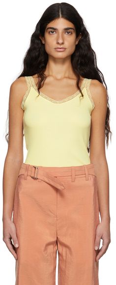 Sleeveless rib knit cotton-blend tank top in yellow featuring lace trim. Scoop neck collar. Supplier color: Pale yellow | Tanner Fletcher Yellow Flo Lace Trim Ribbed Tank Tanner Fletcher, Lace Trim Tank Top, Tank Top Camisole, Ribbed Tank, Pale Yellow, Cami Tanks, Knit Cotton, Women Lace, Neck Collar