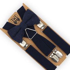 This beautiful Navy bow tie & suspenders set is a perfect choice for a holiday, wedding, groomsmen, best man, ring bearer outfit, birthday celebration or any other special occasion! SIZING:   Х-SMALL: 6mo-4yrs  * Bow Tie: 4 in wide  * Suspenders: Adjustable from 16" to 27" (38 cm - 68 cm), X- back. SMALL: 5yrs-10yrs  * Bow Tie: 4 in wide * Suspenders: Adjustable from 20" to 32" (50 cm - 85 cm), X- back. MEDIUM: 10yrs-18yrs (up to 5'6") * Bow Tie: 4.5 in wide * Suspenders: Adjustable from 24" to Bow Tie And Suspenders Set For Father's Day Party, Adjustable Bow Tie Back Bow As Gift, Elegant Party Belt With Bow, Adjustable Bow Tie For Groom, Adjustable Dapper Belts And Suspenders For Party, Adjustable Bow Tie For Suit As Gift, Adjustable Bow Tie For Gifts, Dapper Adjustable Bow Tie For Father's Day, Adjustable Bow Tie For Party