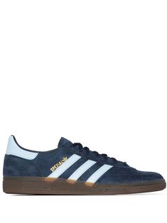 How do you gear up for a great day? Why not slip into a pair of blue suede Handball Spezial sneakers from Adidas that has a bright design which will definitely help put your best foot forward. Say hello to your new favourite "solemate". Featuring a round toe, stitched panels, a lace-up front fastening, a logo patch at the tongue, a branded insole, a contrasting heel counter, a signature three stripe detail and a rubber sole. POSITIVELY CONSCIOUS: Adidas Group scores 4 out 5 by independent ethica Blue Skate Shoes With Three Stripes And Round Toe, Blue Three Stripes Skate Shoes With Round Toe, Sporty Navy Sneakers For Skateboarding, Blue Low-top Sneakers With Three Stripes, Adidas Navy Sneakers With Rubber Sole, Adidas Blue Sneakers With Three Stripes, Navy Sports Sneakers With Gum Sole, Sporty Navy Adidas Sneakers, Blue Skate Shoes With Three Stripes For Streetwear