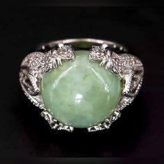 Gorgeous Vintage Owned Jade Ring In Sterling Silver, Jade Stone Setting. Size- 7.5 Us Weight - 12g Top: 16mm (Approx.) Band: 4mm (Approx.) Beautiful Burmese Green Jade Sterling Silver Ring. Enchanting Filigreed Cocktail Ring, Features A Main Stone Of Green Jade In A Whimsical Setting Of 4 Butterflies. Beautiful Condition, Never Been Worn. All Of Our Pieces Were Purchased Brand New In The U.A.E. All Stones Are In Excellent Condition. A Wonderful Statement Ring. Silver Jade Rings For Formal Occasions, Formal Silver Jade Ring, Luxury Silver Jade Round Ring, Luxury Silver Jade Ring, Silver Emerald Collectible Ring, Silver Jade Ring, Jade Engagement Ring, Green Jade Ring, Jadeite Ring