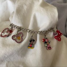 Authentic Disney Charm Bracelet Purchased At Disneyland Approximately 8 Inches Never Worn Mickey Bling Heart Is Missing A Stone, Which Sucks Because That Means I Bought It That Way You Can’t Tell Unless You Touch It, Still Looks Fine So Cute Clip On Charms, I’m Not Sure If They Still Sell The Charms, But Plenty Of Room To Add More Charms Approximately 3/4 Inches Silver Tone Bracelet Disney Charm Bracelet, Disney Charm, Disney Bracelet, Unique Backpacks, Disney Charms, Clip On Charms, Disney Jewelry, Disney Stuff, Womens Jewelry Bracelets