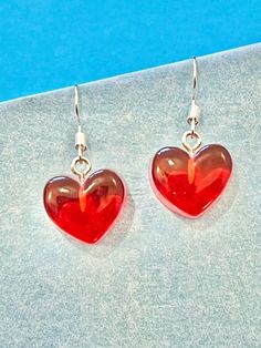 Beautiful Heart red dangle earrings.   These are light weight and look gorgeous.  You can choose from hook or hoop.  The Hoop measures 3cm in width Enjoy... The hook and hoop is made of plated sterling silver to protect your ears and the heart is made of resin. They come well presented and wonderful for a birthday present for a friend, family or your loved one, or maybe a present for yourself. Thank you for taking the time to look at my earrings and please visit my shop for more original designs. Sharlene x For Fun, Funky, Quirky and original designs, please visit my shop.   https://www.etsy.com/uk/shop/bespokedanglers Earrings to suit all xx Sharlene xx Sweet Drop Earrings As A Gift, Sweet Drop Earrings For Gift, Sweet Handmade Earrings For Gift, Sweet Handmade Earrings As Gift, Trendy Earrings For Valentine's Day Gift, Trendy Heart Drop Earrings As Gift, Trendy Valentine's Day Earrings For Gift, Cute Sterling Silver Dangle Earrings, Trendy Valentine's Day Gift Earrings