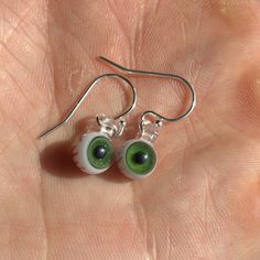 Treat yourself to something fun and spooky today! These eyes are so tiny you have to see them in person to believe the miniscule details. I think it would also be a great gift for any gothic friends you have :) Different materials are available for the ear wire (the hook that goes through the ear), select yours from the drop down menu. Pictured hooks are sterling silver. Green Novelty Earrings For Halloween, Green Earrings For Halloween Gift, Handmade Green Halloween Earrings, Handmade Sterling Silver Halloween Earrings, Quirky Handmade Halloween Jewelry, Halloween Teardrop Jewelry Gift, Green Halloween Dangle Earrings, Green Novelty Jewelry For Halloween, Novelty White Round Earrings