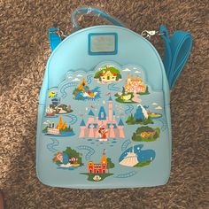 Nwt Disneyland Anniversary Mini Backpack Blue Standard Backpack For On-the-go, Blue Backpack Bag For Trip, Blue Backpack For Trip, Blue Backpack For Trips, Blue Backpack With Detachable Strap, Blue Backpack With Zipper For Disney Trips, Blue Backpack With Case For Everyday Use, Blue Tote Bag For Trip, Blue Crossbody Backpack With Removable Pouch