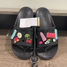 Crocs Classic Embellished Slide Rare Alien Bae. Color Is Black. Multiple Sizes Available! Very Rare Model! All Pieces Are Included. Brand New Without Box! All Orders Ship Within 1 Business Day! Crocs Slides Black, Crocs Classic Slide, Jibbitz Ideas, Crocs Slide, Crocs Collection, Crocs Slides, Shoes Crocs, Crocs Black, Kicks Shoes