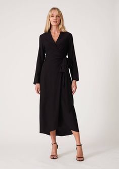 Super soft rayon wrap dress. Long sleeve midi wrap dress with a slip-on design, long sleeves, v-neckline, and a side tie closure. The perfect evening dress for any occasion. Black Faux Wrap Dress For Evening, Elegant V-neck Wrap Dress For Dinner, Fall Maxi Wrap Dress For Brunch, Black Long Sleeve Maxi Dress With Tie Waist, Long Sleeve Faux Wrap Dress For Date Night, Black Faux Wrap Dress For Party, Elegant Long Sleeve Wrap Dress With Tie Waist, Black Faux Wrap Party Dress, Elegant Viscose Midi Dress With Tie Waist