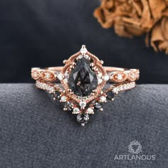 a close up view of an engagement ring with brown and white diamonds