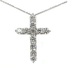 This eye catching cross pendant has an astonishing 11.25 ct. total weight of beautiful F color and VS1 clarity round brilliant cut lab created diamonds. Each diamond weighs no less than 1.00 ct. each and they are set in 14 kt. white gold on a 16" cable link chain also in 14 kt. white gold. Diamond White Cubic Zirconia Cross Necklace, White Gold Cubic Zirconia Cross Necklace, Anniversary Cross Necklace In Brilliant Cut Diamond White, Anniversary Cross Necklace In Diamond White With Brilliant Cut, Anniversary Diamond Cross Necklace Vvs Clarity, Brilliant Cut Cubic Zirconia Cross Pendant Necklace, Brilliant Cut Cubic Zirconia Crucifix Necklace, Anniversary Diamond Cross Necklace With Vvs Clarity, Cubic Zirconia Brilliant Cut Crucifix Necklace