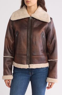 This faux-leather jacket is trimmed in fluffy faux shearling to bring an extradose of warmth to your cold-weather attire. 23" length (size Medium)
 Front zip closure
 Spread collar Long sleeves Front zip pockets 100% polyester with polyurethane coating; 100% polyester faux-shearling trim Dry clean Imported Winter Sheepskin Outerwear With Zipper Closure, Fall Sheepskin Fur Coat With Fleece Lining, Fall Outerwear With Fleece Lining And Sheepskin, Winter Shearling Leather Jacket With Zipper, Fall Sheepskin Outerwear With Fleece Lining, Winter Shearling Leather Jacket With Zipper Closure, Winter Shearling Outerwear With Zipper Closure, Fall Faux Fur Coat With Fleece Lining, Sheepskin Biker Jacket With Faux Fur Trim