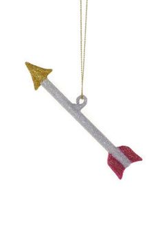 an ornament shaped like a rocket with two gold and silver stars on it