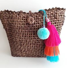 Pompom Tassel Bag Accessory in Orange Pink and Blue Beach Shoulder Bag With Tassels, Rectangular Shape, Rectangular Beach Bag With Tassels For Summer, Rectangular Summer Beach Bag With Tassels, Beach Bags With Fringe For Beach Season, Rectangular Straw Bag With Tassels For Beach, Tassel Straw Tote Bag For Beach Season, Rectangular Straw Beach Bag With Tassels, Tassel Tote Straw Bag For Beach Season, Bohemian Straw Bag With Tassels For Daily Use