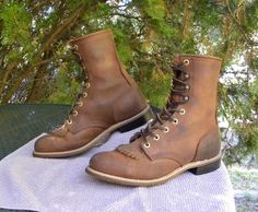 For Sale : USA Made preowned Vintage PD Tuff Apache brown oiled leather leather western paddock/jodhpur lace up Boots with kilties in Womens size 8.5. Measure your feet/boots with a like toe then refer to the measurements below. Removable kilties Roper toes Block Heels with Biltrite Caps Brass Hardware 120 + ridged rubber Outsoles   Spur ledge Soft suede interiors Apache brown Leather Reinforced stitching  rawhide Laces PD TUFF USA logo embossed into the outside heels Condition: Less than Averag Rustic Lace-up Leather Work Boots, Vintage Lace-up Oiled Leather Boots, Rustic Work Boots With Oiled Leather And Snip Toe, Rustic Oiled Leather Work Boots With Snip Toe, Rugged Leather Work Boots For Rodeo, Rugged Moto Boots With Moc Toe For Rodeo, Rugged Work Boots With Leather Sole For Rodeo, Rustic Work Boots With Goodyear Welt Construction, Rugged Work Boots With Round Toe For Western-themed Events