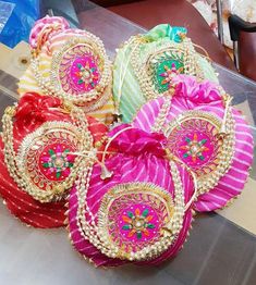 several bags with designs on them sitting on a table