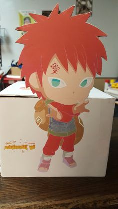 a cardboard box with an anime character on it