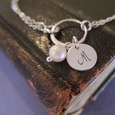 Pearl bridesmaid bracelet with initial Personalized silver | Etsy Silver Pearl Bracelet With Pearl Charm For Mother's Day, Silver Monogram Jewelry For Wedding, Sterling Silver Pearl Bracelet Gift, Hypoallergenic Silver Bracelet For Bridesmaids, Silver Initial Pendant Jewelry With Pearl Charm, Monogram Sterling Silver Jewelry For Wedding, Sterling Silver Monogram Jewelry For Wedding, Silver Jewelry With Pearl Charm Initial Pendant, Elegant Hand Stamped Necklaces For Wedding