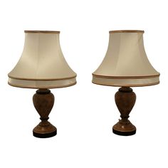 two lamps sitting next to each other on a white background