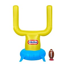 an inflatable football game set with a football on the ground and a tube like object