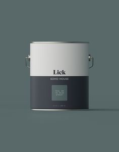 a paint can with the words lick on it in black and white, against a gray background