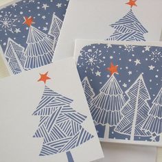 three cards with christmas trees on them and red stars in the top right hand corner