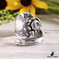 "A beautiful vintage rose ring!  The original pattern was made in the early 1900s by Shiebler (called \"American Beauty\") and depicts a lovely bouquet of roses at the tip with delicate design down the sides. This ring is made from a vintage sterling silver spoon, 925, nickel-free. This ring will be adjusted to the size you request but it can easily be tightened or loosened at home should you want a different fit. As these are antique items, there may be minor wear and tear from its past life. S Vintage Oval Jewelry With Rose Design, Vintage Flower Engraved Ring For Anniversary, Vintage Stamped Engraved Open Ring, Vintage Engraved Flower Ring For Gift, Vintage Engraved Flower Ring Gift, Adjustable Rose Flower Ring, Vintage Rose Flower Ring For Wedding, Vintage Stamped Wedding Rings, Vintage Engraved Flower Promise Ring