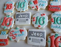 decorated cookies are arranged in the shape of jeeps for a sweet sixteen birthday party