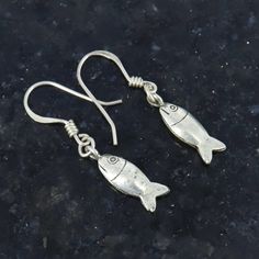 Fish Earrings, 925 Sterling Silver, Tiny Earrings, Fish Jewellery, Handmade Jewelry, Antique Earrings, Beach Jewellery, Christmas  Sale Product Details : Material : 925 Sterling Silver Earring Length : 40.5mm Approx Earring Width : 7mm Approx Earring Weight : 3.580 grams approx This jewellery is pure 925 Sterling silver and perfect for sensitive skin. Our product are totally hypoallergenic (perfect for sensitive skin) and made with high quality gemstones and 925 solid Sterling silver. Thank you Handmade Fish-shaped Earrings For Gifts, Silver Dangle Earrings With Fish Hook, Silver Fish-shaped Earrings With Ear Wire, Silver Sterling Fish-shaped Earrings, Silver Fish-shaped Sterling Silver Earrings, Silver Fish-shaped Earrings With Fish Hooks, Handmade Silver Fish-shaped Earrings, Silver Drop Earrings With Fish Hook, Nickel-free Silver Fish-shaped Earrings