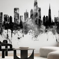 a black and white cityscape wall mural in a living room