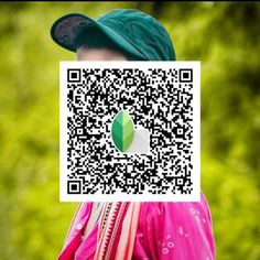 a person wearing a green hat and pink shirt with a qr code on their face