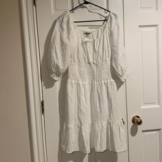 This Boston Proper White Peasant Style Dress Is A Canvas For Your Fashion Imagination! Go For A Natural For A Clean Crisp Look Or Add A Pop Of Color Jewelry For A Stand Out Statement! Size Medium New/Never Worn Location E-73 Summer Peasant Dress With Puff Sleeves, Spring Peasant Dress With Puff Sleeves, Spring Casual Peasant Dress With Ruffle Hem, Casual Spring Peasant Dress With Ruffle Hem, Spring Peasant Dress With Short Sleeves, Casual Summer Peasant Dress With Puff Sleeves, Casual Peasant Dress For Brunch, Summer Peasant Dress For Brunch, Casual Peasant Dress With Short Sleeves For Vacation