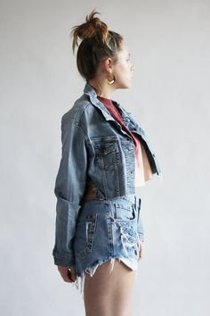 Denim Wrangler jacket*Vintage item*90s look*Blue denim*For women*Cut and frayed bottomSize: XL on tagArmpit to armpit: 101,5 cm / 40 inchesLength: 38 cm / 15 inchesOuter Sleeve: 57 cm / 22,5 inchesShorts from pictures are available here:https://www.etsy.com/listing/536117619/mustang-denim-shorts-vintage-high-waist?ref=shop_home_active_3&pro=1&frs=1And crop top is available here:https://www.etsy.com/listing/638926374/bleached-crop-top-in-burgundy-pink-color?ga_search_query=crop%2Btop& Vintage Ripped Denim Jacket For Spring, Faded Denim Jacket With Frayed Hem, Faded Cotton Denim Jacket With Frayed Hem, Vintage Denim Outerwear With Frayed Hem, Vintage Outerwear With Frayed Hem In Medium Wash, Vintage Medium Wash Outerwear With Frayed Hem, Spring Vintage Recycled Denim Jacket, Vintage Denim Jacket With Frayed Hem, Vintage Denim Jacket With Frayed Hem In Medium Wash