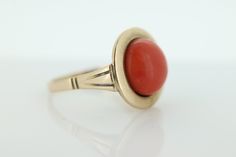 Amazing Statement ring. 8k yellow gold set with a Deep Orange CORAL cabochon gem. The Coral is round cabochon Condition: Shows little signs of wear. Details: 11mm orange Coral 16mm Round top table 8mm rise off finger 5.0grams total weight Marked 333 (8K) Size 8 Formal Fine Jewelry Domed Cabochons, Formal Domed Cabochons Fine Jewelry, Formal Yellow Gold Round Cabochons, Vintage Yellow Gold Gemstone Cabochons, Art Deco Oval Cabochon Gemstone Jewelry, 14k Gold Art Deco Jewelry, Modern Yellow Gold Cabochon Rings, Fine Jewelry Domed Gemstone Cabochons, Domed Gemstone Cabochons Fine Jewelry