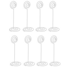 eight lollipops are lined up in rows on a white background, with one line drawn across the middle