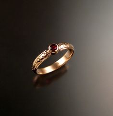 "This pretty ring has a Victorian antique look with a 3.25mm round Ruby red Spinel. Bezel set in 14k rose Gold The band is 4mm wide and 1.25mm thick. Specify your size in a \"note to seller\" at check out." Elegant Hand Forged Ruby Ring For Anniversary, Ruby Red Wedding, Red Wedding Ring, Ruby Engagement Ring Gold, Ruby Ring Designs, Indian Wedding Rings, Jewelry Sketches, Stone Wedding Ring, Indian Rings