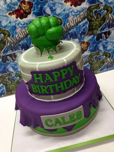 a birthday cake with the hulk logo on it