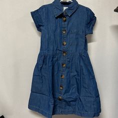 Girls Blue Denim Dress Brand New Size 6x Fully Button Down Lightweight And Super Cute Approx 26” In Length Medium Wash Cotton Dress With Buttoned Pockets, Denim Blue Cotton Dresses With Buttoned Pockets, Blue Cotton Denim Dress With Buttoned Pockets, Dark Wash Short Sleeve Dress With Buttons, Button-up Denim Blue Cotton Dress, Denim Blue Cotton Button-up Dress, Blue Cotton Denim Dress With Buttons, Dark Wash Short Sleeve Dress With Button Closure, Button-up Cotton Denim Dress