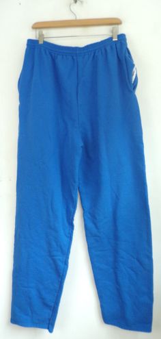 "-Description- >Champion bright blue sweatpants >elastic waist >drawstring at the waist >open bottom >size XL >awesome! >condition: great - name written on the interior tag >color(s): blue >fabric(s): 50 cotton / 50 polyester >brand: champion >care: machine wash -Measurements- >size: XL ✩ all measurements are taken with the item laying flat & some sizes are estimates so please check measurements ✩ waist: 32-35\" / 81-89cm inseam: 33\" / 84cm rise: 16\" / 4 Blue Stretch Cotton Joggers, Blue Sweatpants With Elastic Waistband For Jogging, Blue Stretch Cotton Sweatpants, Blue Sweatpants For Jogging, Blue Jogging Bottoms, Blue Stretch Sweatpants For Jogging, Blue Stretch Sweatpants With Pockets, Blue Relaxed Fit Sweats For Jogging, Blue Relaxed Fit Full-length Sweatpants