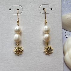 This lovely golden sun pearl earring is made with 14k gold plated hardware and natural freshwater pearls. 💨Hook-we use high quality 14k gold plated hook which is made in USA. 14k gold plated hook is good for sensitive ears. 💨Pearl- size is about 6-8mm Freshwater pearls are unique and rarely perfect. Sometimes they will have slight imperfections, small blemishes or irregular shapes. Elegant Pearl Earrings With Pearl Charm For Summer, Elegant Pearl Charm Earrings For Summer, Elegant Summer Pearl Earrings With Pearl Charm, Elegant Summer Pearl Earrings, Summer Pearl Earrings For Pierced Ears, Summer Pearl Earrings, Elegant Gold Pearl Earrings For Summer, Summer Pearl Drop Earrings, Summer Pearl Drop Dangle Earrings