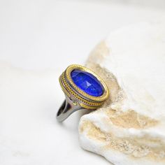 LAPIS LAZULI RING, Chunky Gemstone Statement Ring, Sterling Silver Ring, Gift For Her, Rings For Women, Classy Gemstone Ring, Vintage Ring Gemstone: Genuine Lapis Lazuli. Birthstone: (February 19 - March 19). Zodiac: Sagittarus. Chakra: Third Eye, Throat. Lapis Lazuli is a crystal of truth in all aspects. It reveals inner truth, and promotes self-awareness and the acceptance of that knowledge. Use the drop down list to select the color finish you prefer (plain silver, yellow gold). ⚜️Weight: 16.4gr   💎Gemstone: lapis lazuli doublet 1.5cm x 1.3cm Beautiful and unique gemstone ring made with fine quality of lapis lazuli and quartz comes to life after special craftsmanship with 925 sterling silver and give us this one of a kind ring. 🦚 Visit my gemstone rings collection:  https://www.etsy.c Cabochon Open Ring For Jewelry Making, Oval Sapphire Rings For Jewelry Making, Luxury Rings With Large Stone For Gift, Lapis Lazuli Ring, February 19, March 19, Unique Gemstones, Vintage Ring, Rings For Women