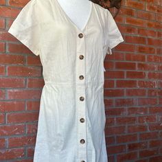 Women’s Calf Length Button Front, Cream Colored Dress. 22” Ptp. Smoke And Pet Free Home. Casual Beige Button-up Dress, Casual Cotton Dress With Button Back, Casual Button Back Midi Dress, Casual Midi Length Dress With Button Back, Casual Summer Dresses With Button Back, Casual Beige Shirt Dress With Buttons, Beige Cotton Midi Dress With Buttons, Casual Dresses With Button Back For Day Out, Casual Shirt Dress With Buttons For Daytime