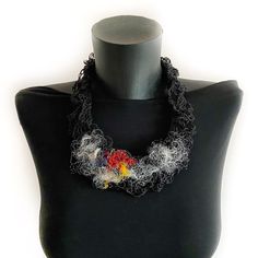 Introducing our Unique Black Statement Necklace - a true one-of-a-kind accessory, work of art that expresses individuality and personal style. Features and details: - Handmade item: This wearable work of art is meticulously handcrafted with the utmost attention to detail. Using a combination of knitting, crocheting, and stitching techniques, this necklace showcases a unique design that is both visually appealing and completely original. The black foundation of the necklace is adorned with eye-ca Artsy Necklace With Unique Variations For Party, Artsy Necklaces For Parties, Artistic Handmade Party Jewelry, Black Jewelry With Artistic Design, Black Artistic Jewelry, Black Necklaces With Unique Variations As Gifts, Black Necklace With Unique Variations For Gift, Black Jewelry With Artistic Design As Gift, Multicolor Handmade Necklace Wearable Art