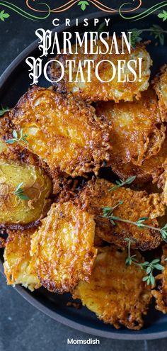 crispy parmesan potatoes on a black plate